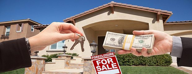 Handing Over Cash for House Keys in Front of House and Foreclosure Sign