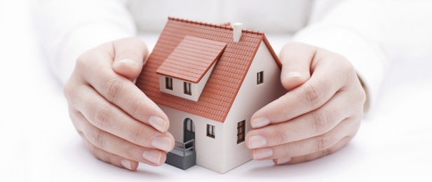 Hands Around a Model House