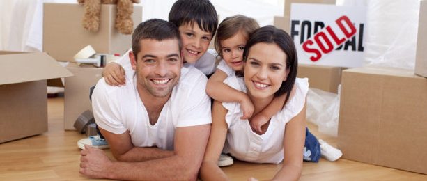 Happy Family Lying on Floor After buying New House