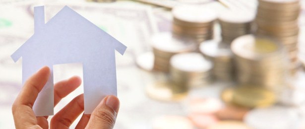 House Shape of Paper and Coins in Background