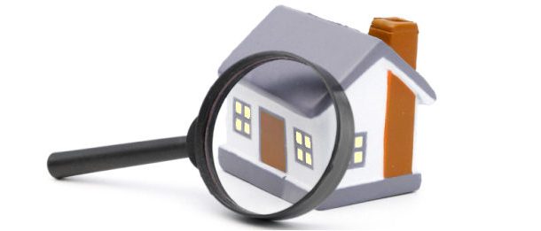 Magnifying Glass Examining Model Home